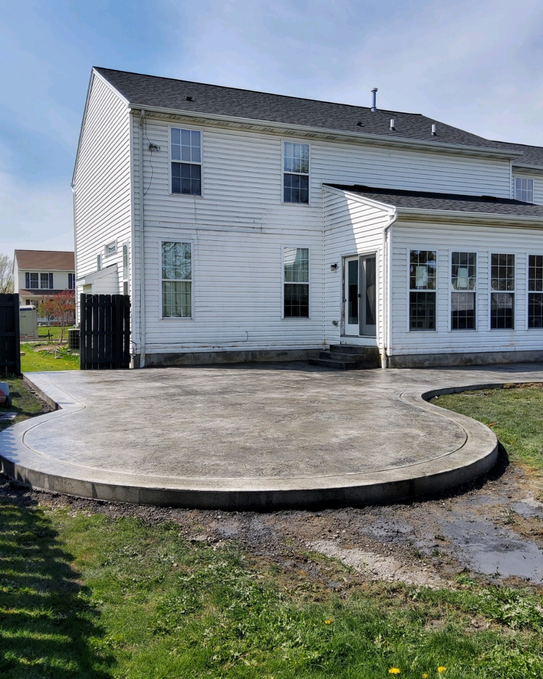 Finished stamped concrete patio with a curved bullnose edge in Buffalo NY